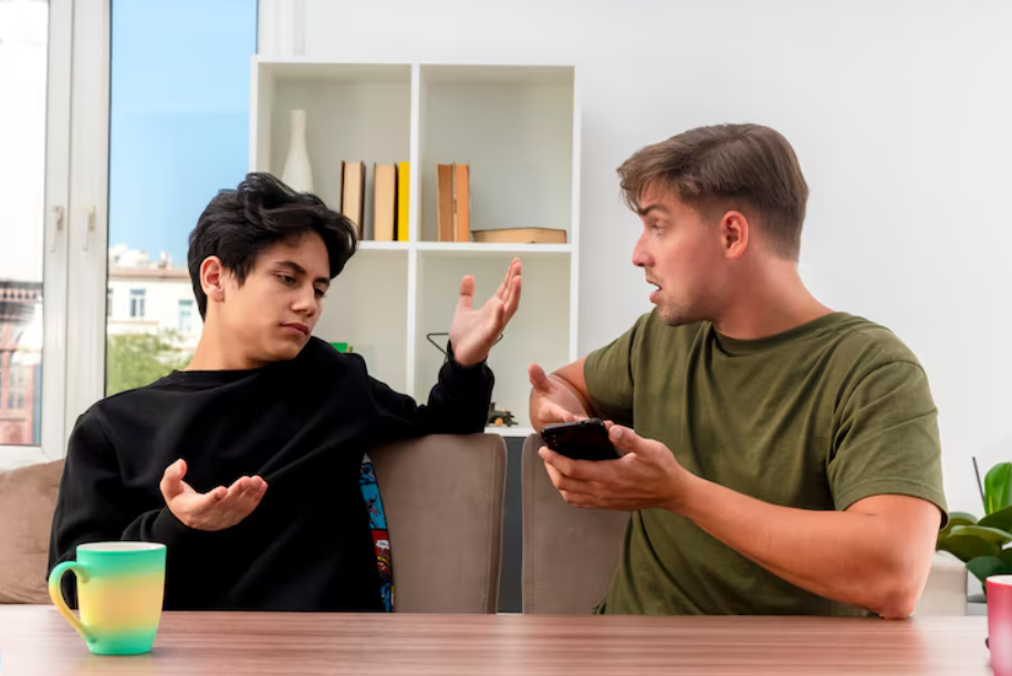 Two friends complaining at a kitchen table, illustrating the science of venting and negativity.