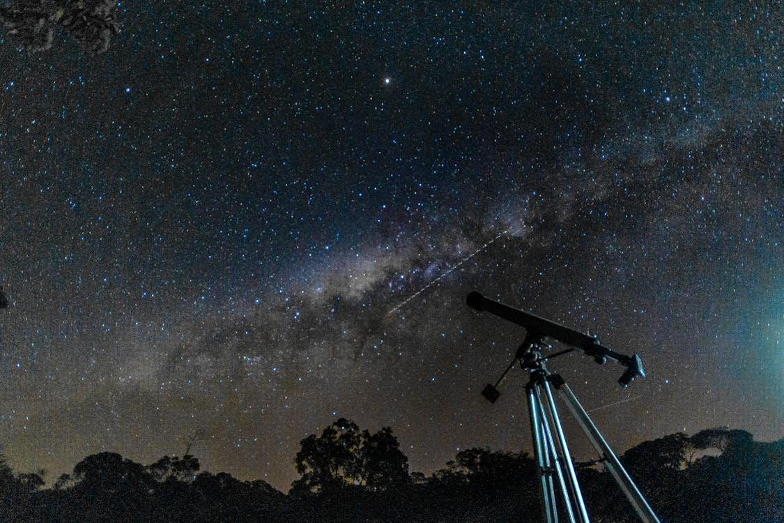 Telescope under the Milky Way night sky—symbolizes the search for extraterrestrial life